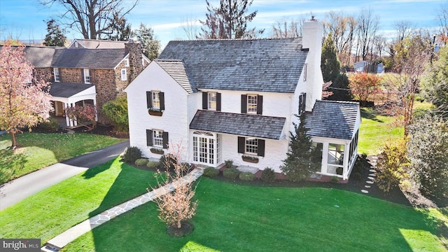 view of front of property featuring french doors and a front yard