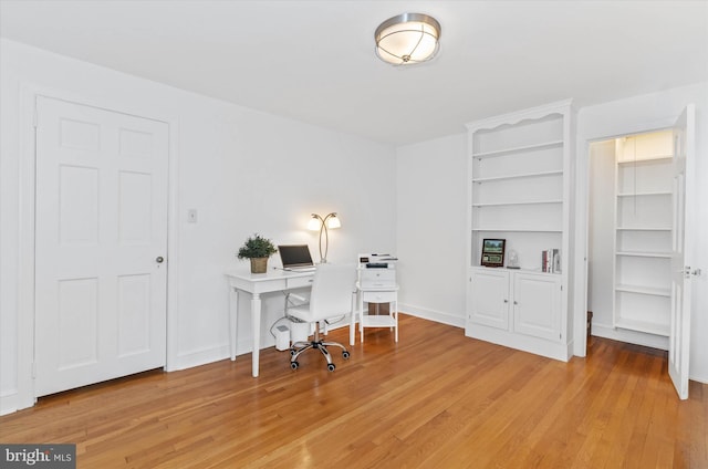 office with light hardwood / wood-style flooring