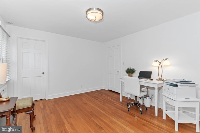 office area with wood-type flooring