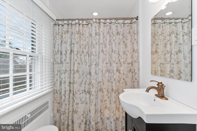 bathroom with vanity and walk in shower