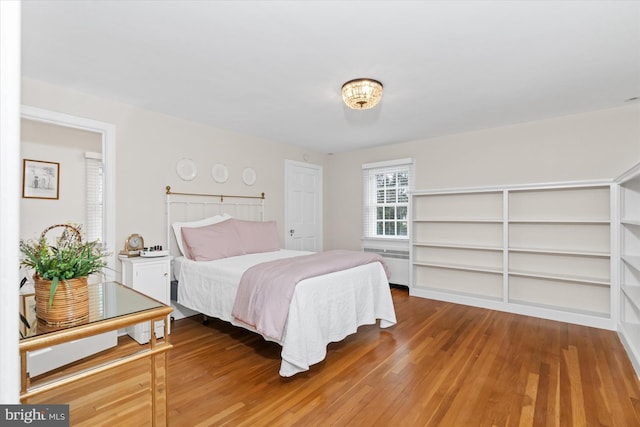 bedroom with wood-type flooring