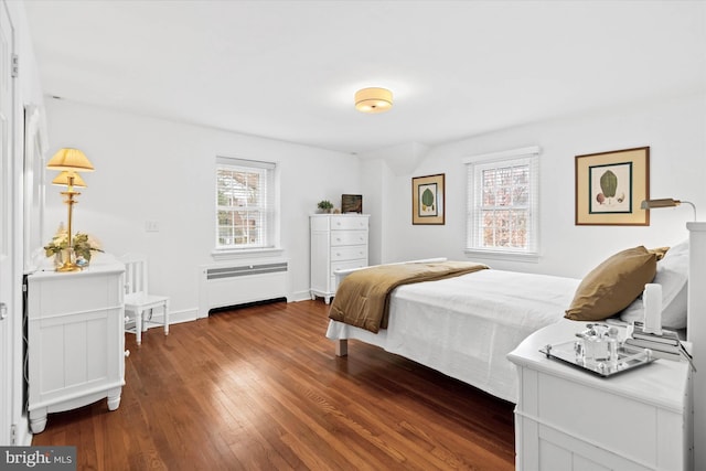 bedroom featuring dark wood-type flooring and radiator