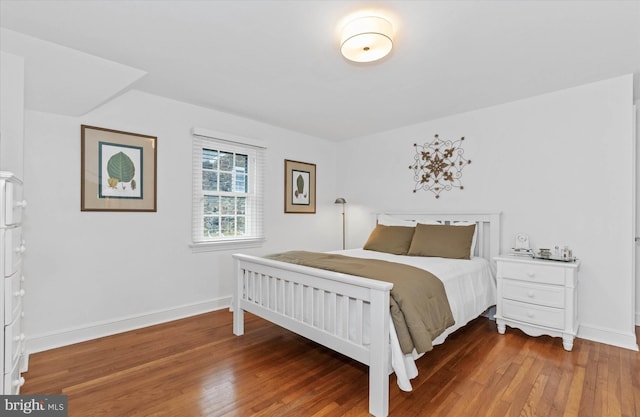 bedroom with hardwood / wood-style floors