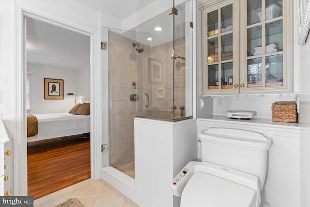 bathroom featuring walk in shower and tile patterned floors