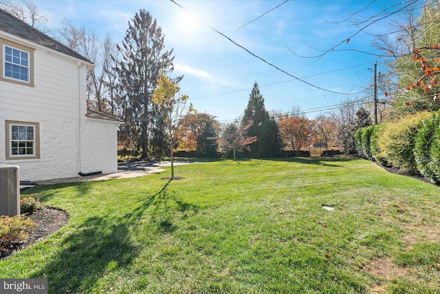 view of yard with central AC