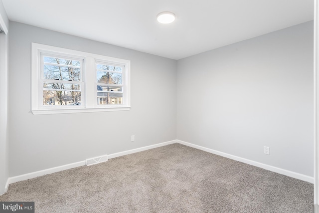 view of carpeted spare room