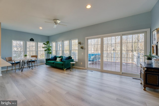 interior space featuring light hardwood / wood-style floors and ceiling fan