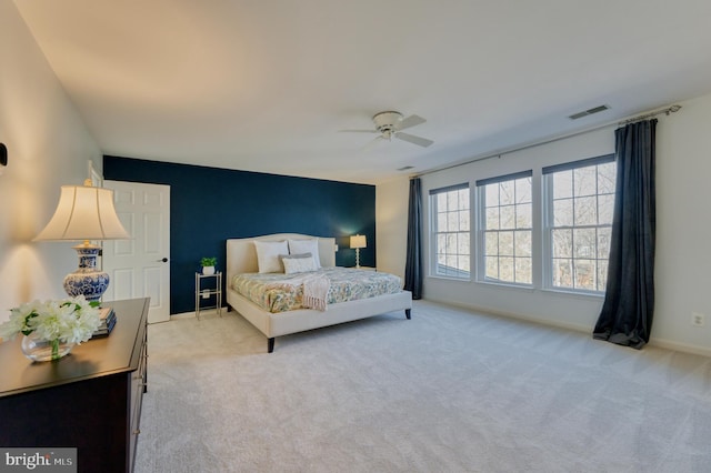 carpeted bedroom with ceiling fan