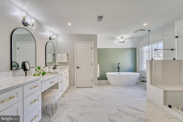 bathroom featuring shower with separate bathtub and vanity