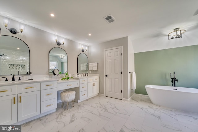 bathroom with vanity and shower with separate bathtub