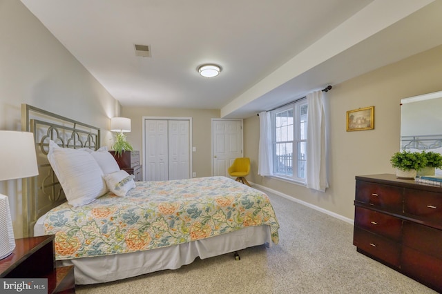 carpeted bedroom featuring a closet