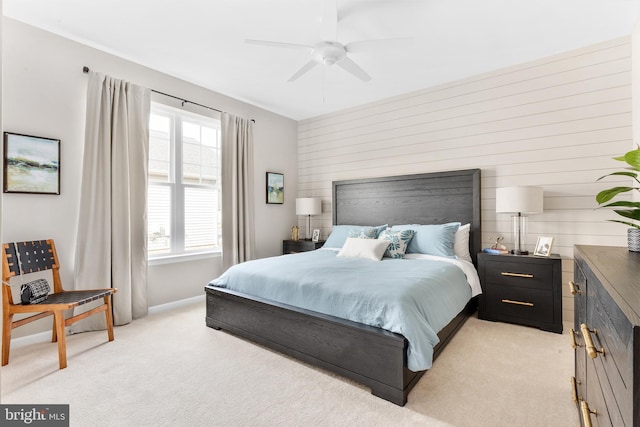 bedroom with ceiling fan and light colored carpet