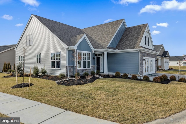 view of front of property with a garage and a front lawn