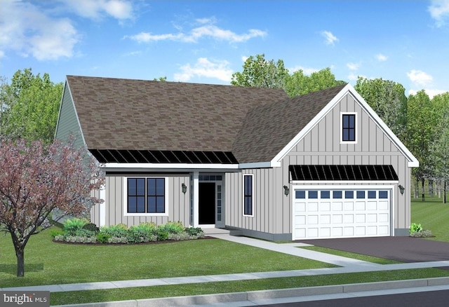 view of front facade with a garage and a front lawn