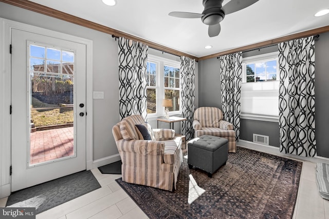 sitting room featuring visible vents, ceiling fan, baseboards, ornamental molding, and recessed lighting