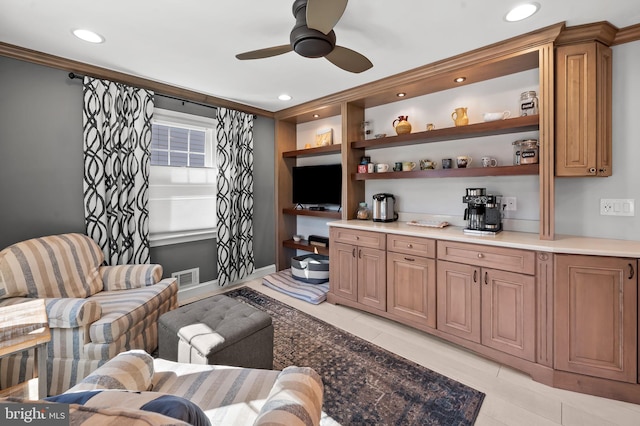 living area featuring visible vents, built in shelves, recessed lighting, light tile patterned floors, and ceiling fan