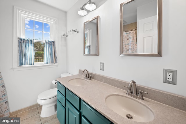 full bathroom with a sink, toilet, double vanity, and tile patterned flooring