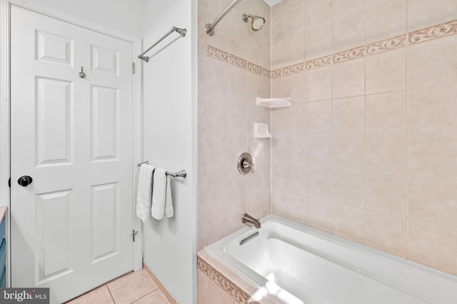 bathroom with tile patterned floors and tiled shower / bath combo