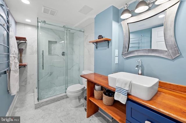 full bathroom featuring a marble finish shower, visible vents, toilet, and vanity