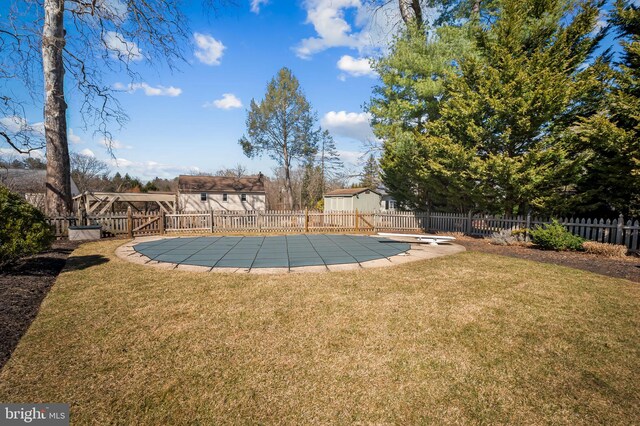 view of yard with a fenced in pool, a patio, and fence