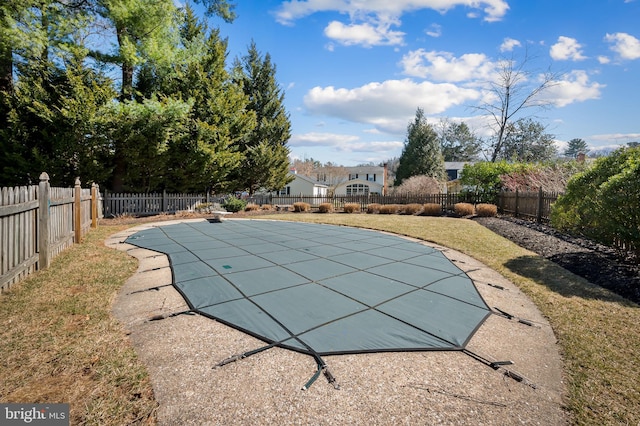 view of pool featuring a yard, a fenced in pool, and a fenced backyard