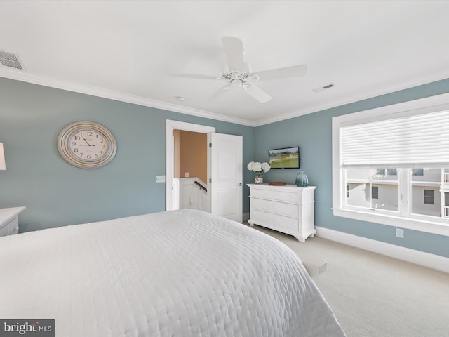 bedroom with ceiling fan, light colored carpet, and ornamental molding