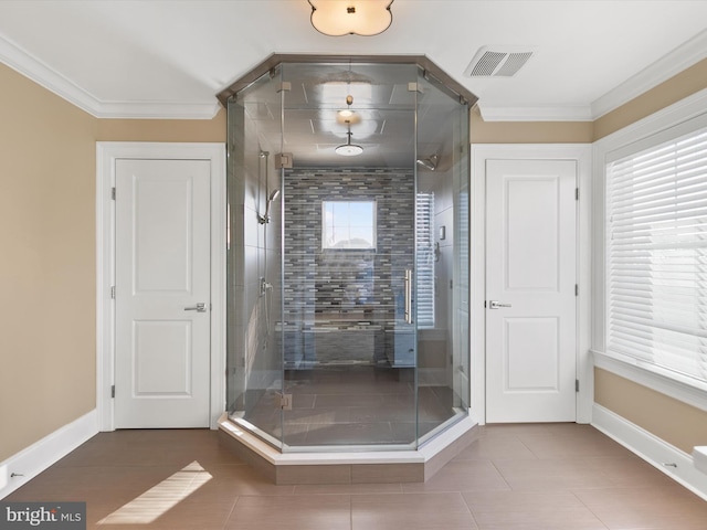 bathroom with ornamental molding and walk in shower