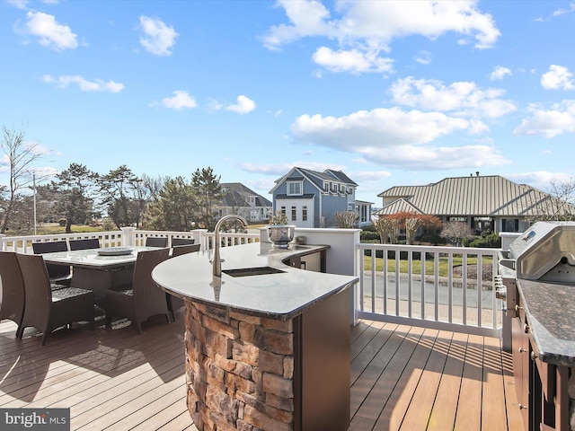 deck with an outdoor wet bar