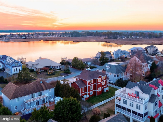 aerial view at dusk with a water view