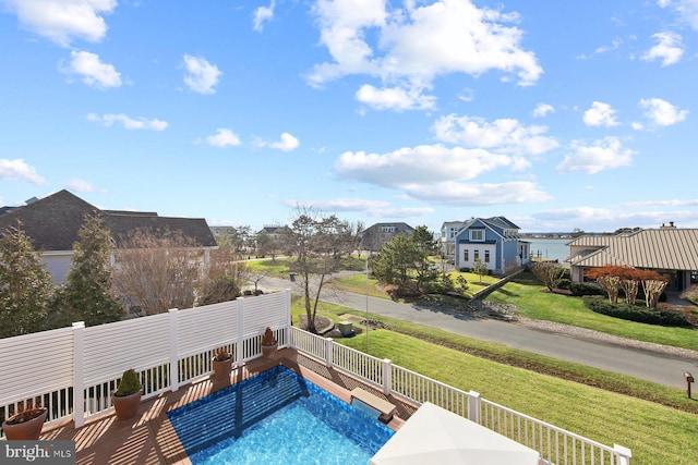 view of pool featuring a yard