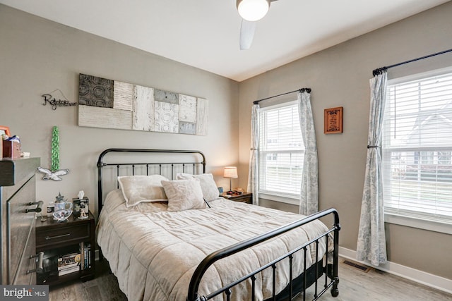 bedroom featuring wood-type flooring and ceiling fan