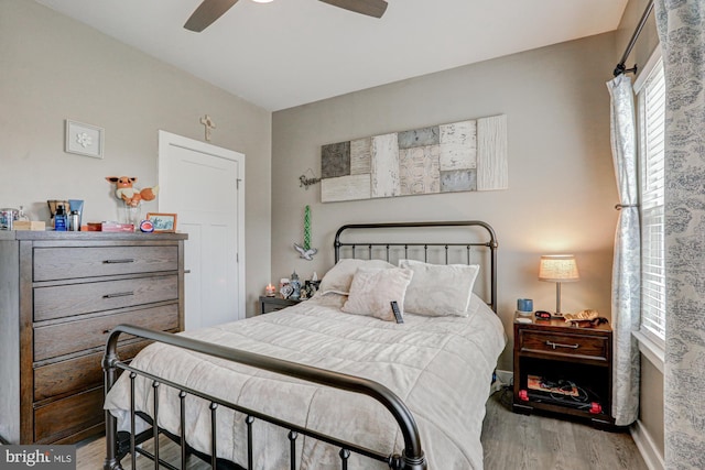 bedroom featuring ceiling fan and light wood-type flooring