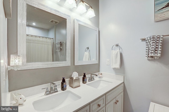 bathroom featuring vanity and a shower with shower curtain