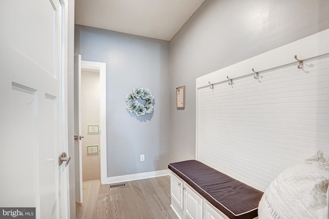 mudroom with light hardwood / wood-style flooring