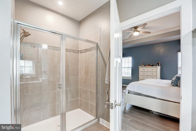 bathroom featuring walk in shower, hardwood / wood-style floors, ceiling fan, and french doors