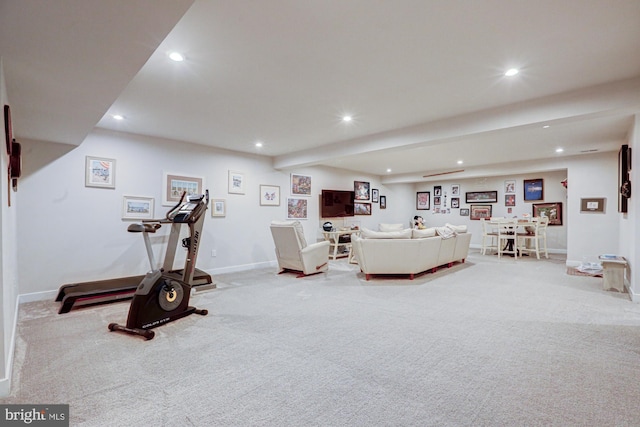 workout room featuring light colored carpet