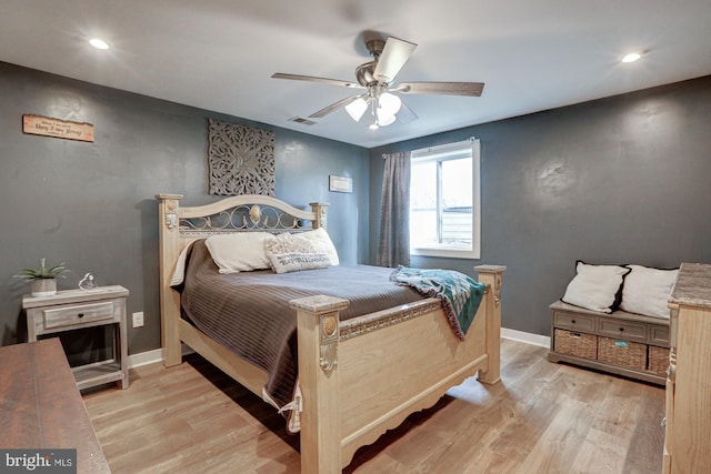 bedroom featuring ceiling fan and light hardwood / wood-style flooring