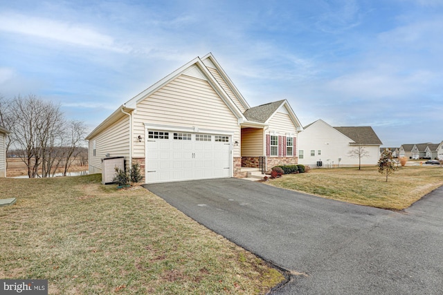 view of front facade featuring a garage and a front lawn