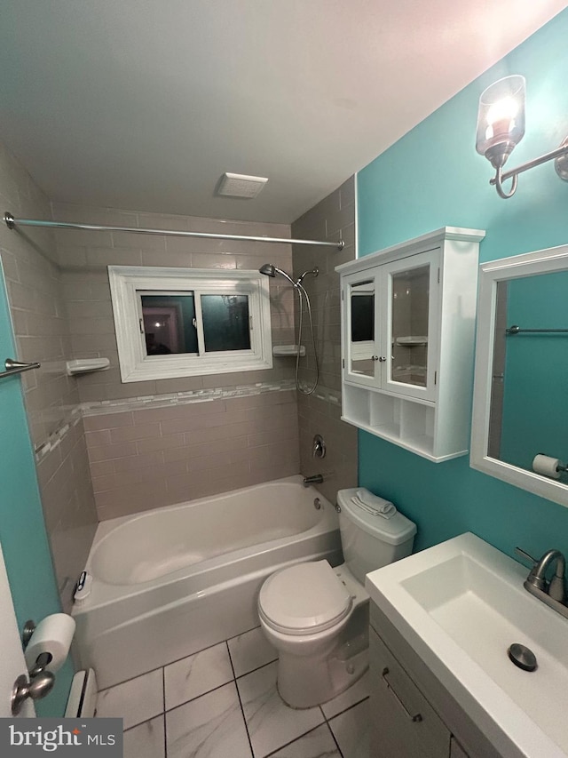 full bathroom featuring vanity, toilet, and tiled shower / bath combo