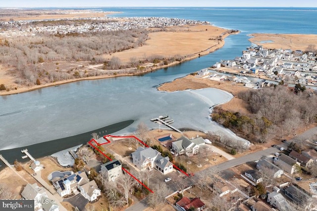 birds eye view of property with a water view