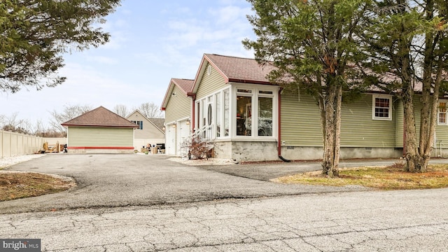 exterior space with crawl space and fence