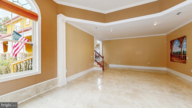 empty room with stairs, baseboards, and crown molding