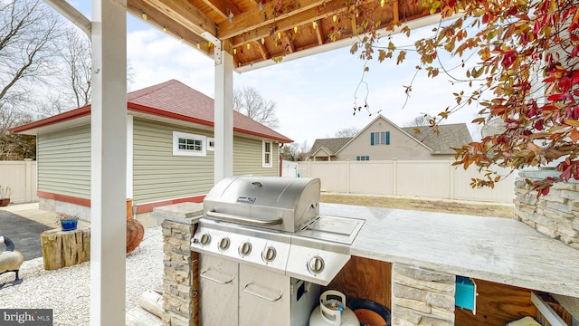 view of patio featuring a fenced backyard and area for grilling