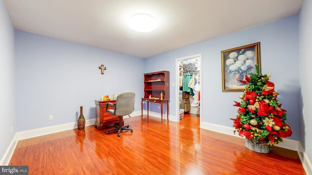 office featuring baseboards and wood finished floors