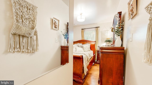 bedroom with wood finished floors