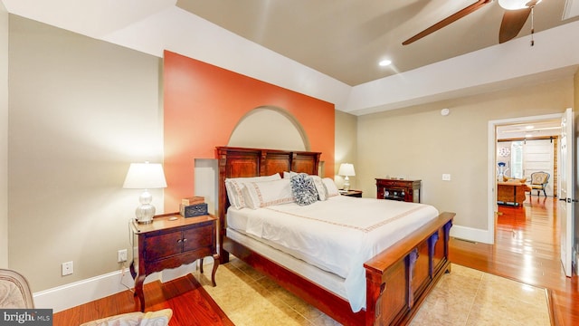 bedroom with recessed lighting, light wood-style flooring, and baseboards