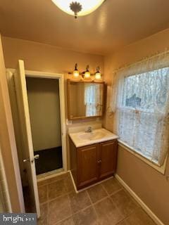 bathroom with tile patterned flooring and vanity