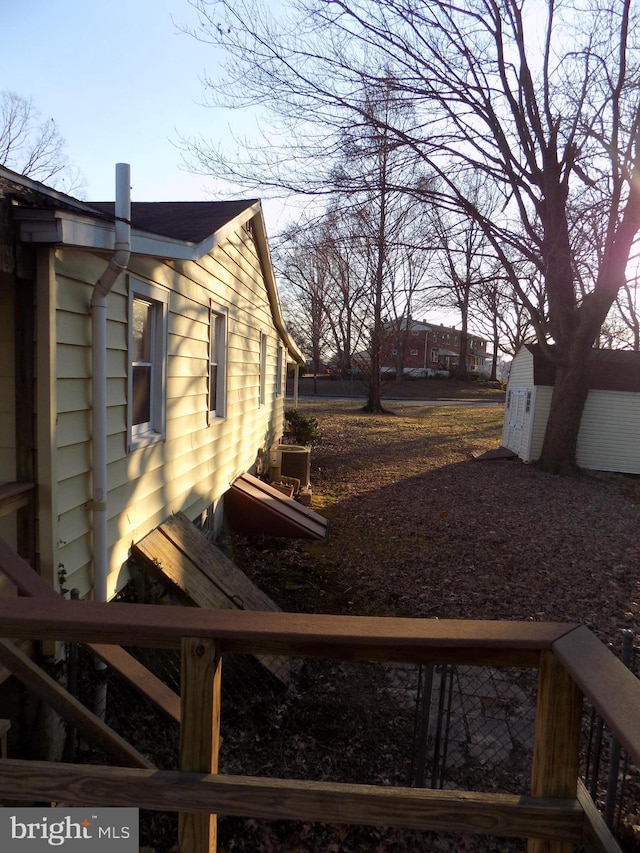 view of side of home featuring central AC unit