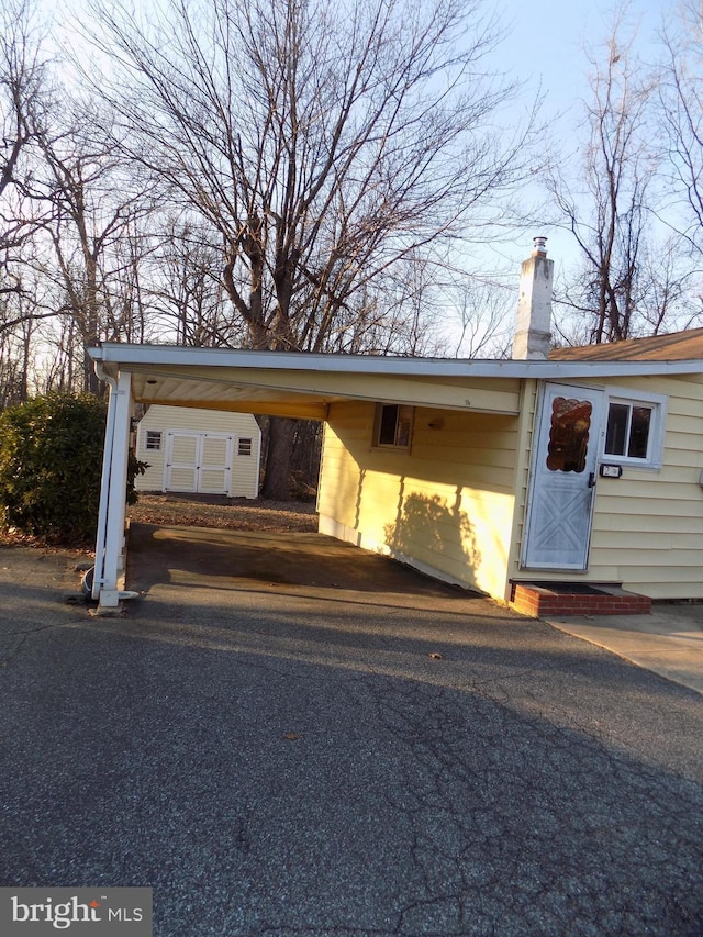 exterior space featuring a carport