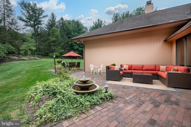 view of patio featuring outdoor dining area, outdoor lounge area, and fence